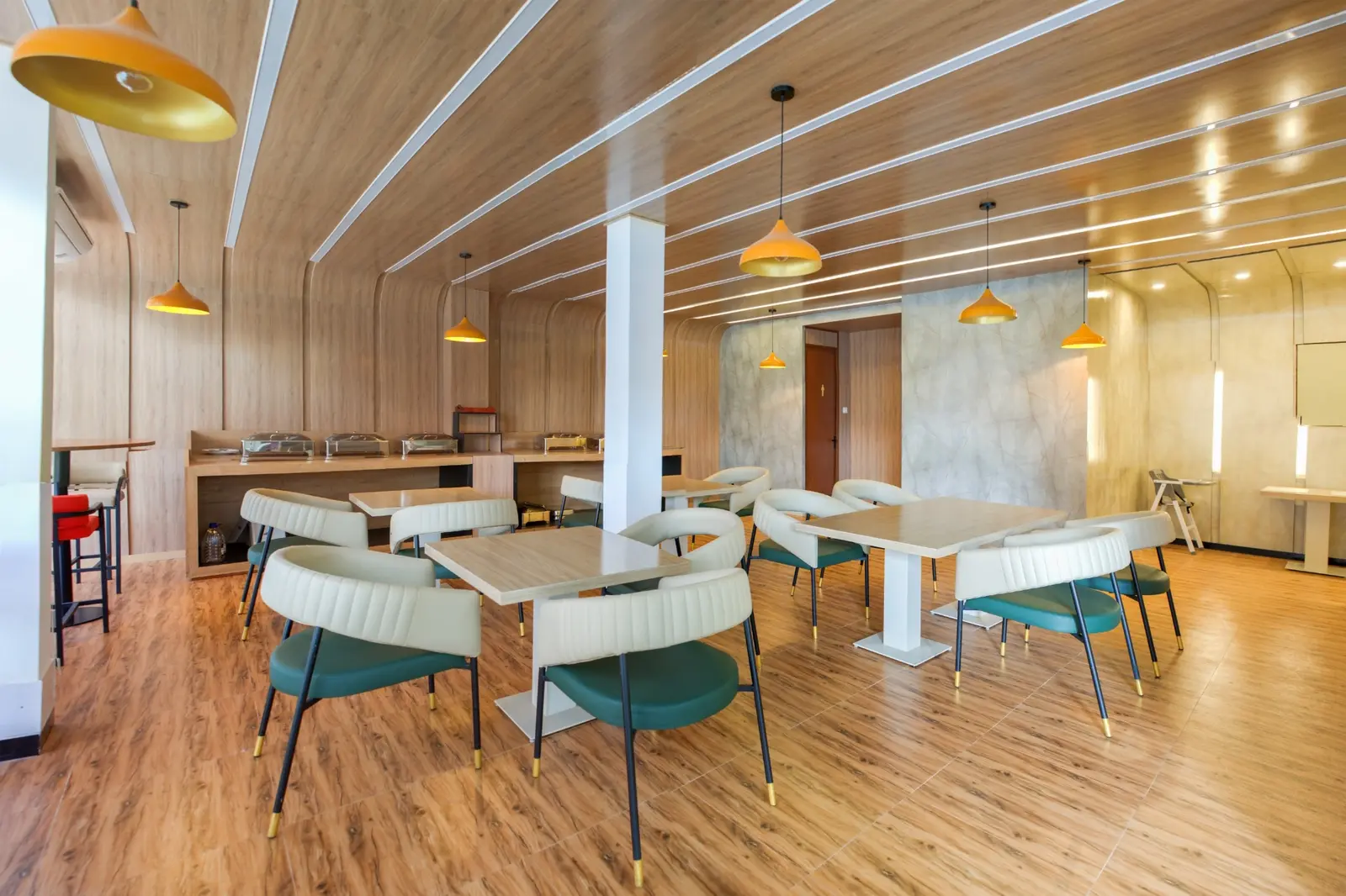 Bright indoor restaurant and buffet area at Leora by White Land